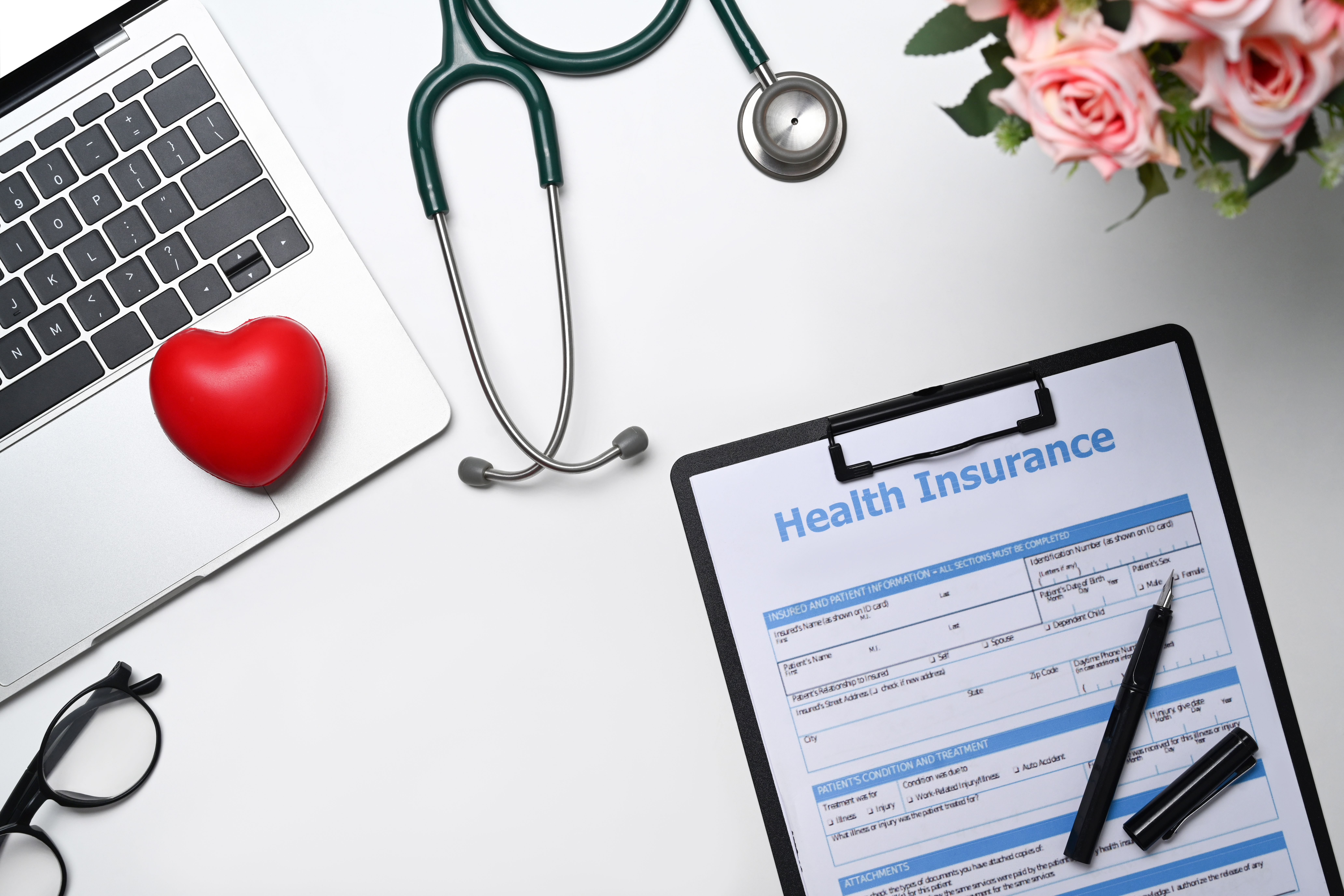 stethoscope, medical report and laptop on white background. heal